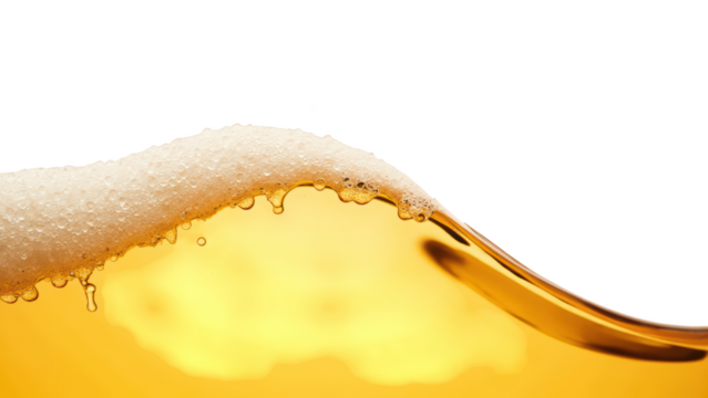 Golden liquid with frothy bubbles creates refreshing and inviting appearance, perfect for beverage enthusiasts
