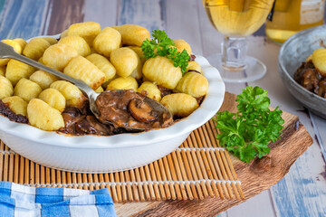 Beef and mushroom pie topped with potato gnocchi