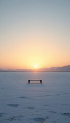 Minimal salt flat at golden hour with bench silhouette and pastel gradient sky