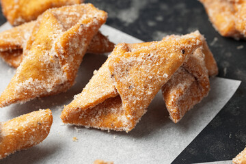 Angel Wings, Faworki, cakes. sweet pastry deep fried and sprinkled with powdered sugar.