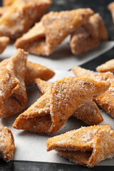 Angel Wings, Faworki, cakes. sweet pastry deep fried and sprinkled with powdered sugar.