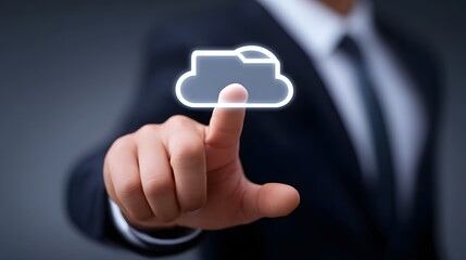A businessman in a suit reaching out to touch a glowing, virtual cloud icon, symbolizing the integ n of cloud computing technology in modern business ope ns and digital transformation.