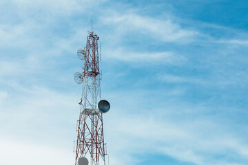 Telecommunication Signal Tower with Antennas against Blue Sky