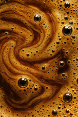 Swirling coffee foam texture with bubbles and rich brown tones macro view of freshly brewed espresso surface background