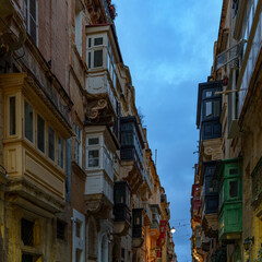 Canyon of Enclosed Maltese Balconies under Blue Dusk Sky