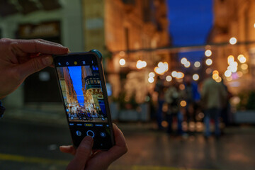 Smartphone Street Capture at Blue Hour with Festoon Lights and Bokeh