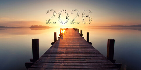 Dawn of a New Era: Birds Forming 2026 Over a Serene Wooden Pier