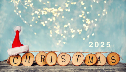 chain of wooden letters with christmas and red santa hat