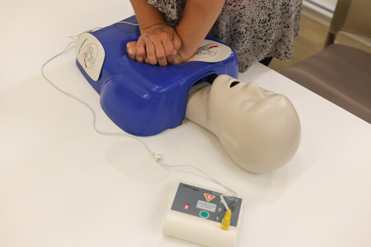 First aid class teaching cardiopulmonary resuscitation (CPR) techniques