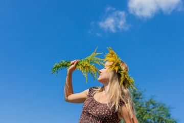 A woman is allergic to ragweed. Selective focus.