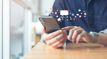 close up businessman hand use smartphone to work about futuristic of social media and business on online marketing with icon for internet network technology and business concept