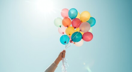 Colorful balloons floating against a blue sky
