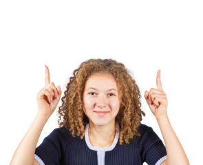Contented teenage girl with curly hairstyle, pointing both forefingers up, looking positive to camera. Frizzy ginger woman adolescent isolated on transparent background