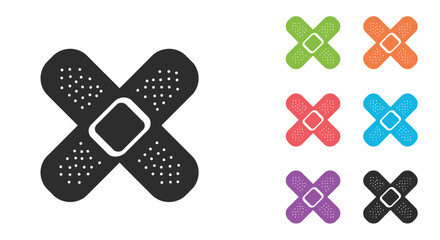 Colorful adhesive bandages in various shades and a black silhouette