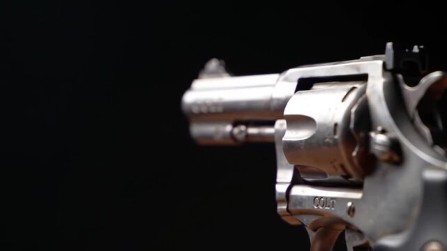revolver firing gunshot slow motion bullet casing smoke