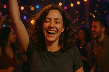 Smiling woman dancing at party with colorful lights and confetti