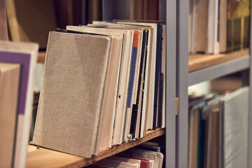 Many book shelves in a library