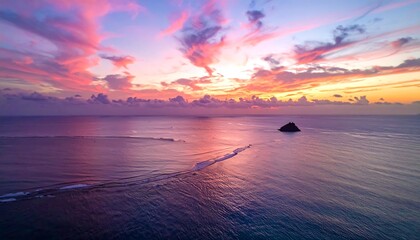 Vibrant Sunset Over Tranquil Ocean Waters with Island Silhouette.