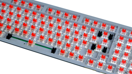 Close-Up Of A Mechanical Keyboard With Red Switches And Transparent Keycaps