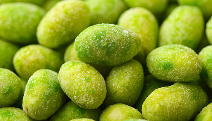 Tasty wasabi coated peanuts as background, closeup