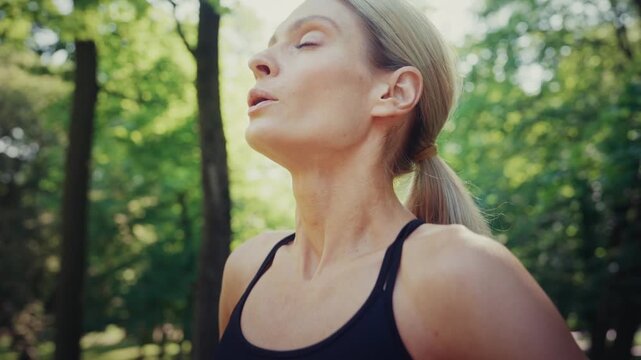 Tired woman catching breath after outdoor workout