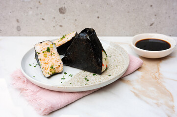 Authentic Japanese onigiri with seaweed wrap, rice balls.