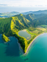 Lagoa do Fogo Lake on Sunny Morning. Green Lush Hills and Mountains. Azores, Sao Miguel Island. Portugal. Aerial Drone Shot © maxterram