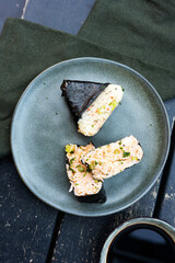 Homemade onigiri rice balls with nori seaweed, authentic Japanese snack.