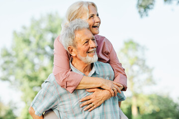 Happy active senior couple having fun outdoors. Portrait of an elderly couple together