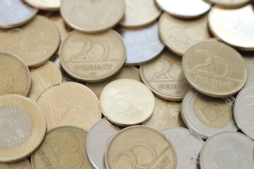 Many forint coins in big pile. Forint is an official Hungarian currency instead euro
