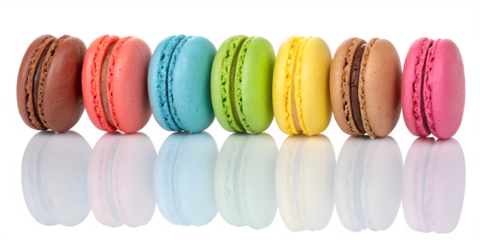 Colorful French macarons stacked in two rows against a black background cookie sweet