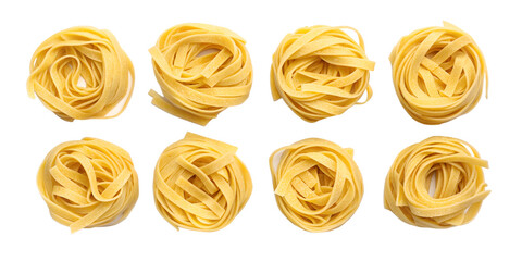Eight nests of uncooked yellow tagliatelle pasta on black background fettuccine