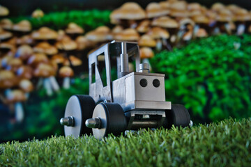 A whimsical macro scene where a toy tractor meets a mushroom forest—blending childhood, fantasy, and industry in a playful visual metaphor. Ideal for themes of creativity, storytelling, and innovation