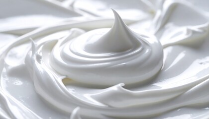 Closeup of creamy white whipped cream texture background.