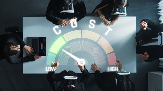 A team of professionals collaborates in a modern office, analyzing cost efficiency using a dynamic meter display to guide strategic financial decisions and insights. Raster
