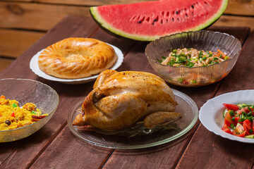 Couscous with dried hands and turmeric, grilled whole chicken,