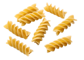 Seven yellow fusilli pasta spirals scattered on a black background italian food uncooked