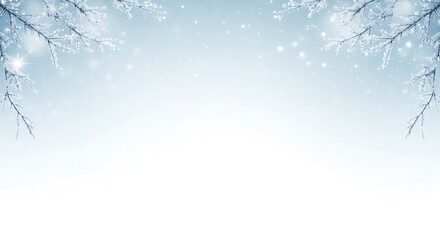 Soft focus winter branches with delicate snowflakes falling against a pale blue sky background