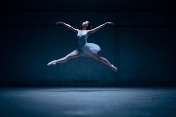 Ballet dancer mid leap in industrial warehouse with dramatic lighting and motion blur