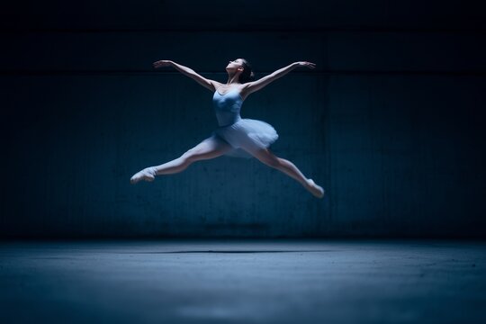 Ballet dancer mid leap in industrial warehouse with dramatic lighting and motion blur