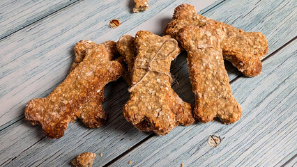 Homemade dog treats close-up on the wooden table. 