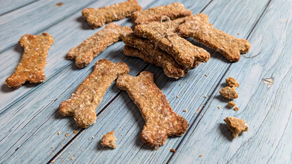 Homemade dog treats close-up on the wooden table. 