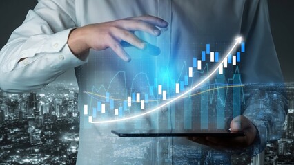 A businessman holds a tablet, showcasing a dynamic digital growth graph above a city skyline at night, illustrating modern business analytics and innovation. Copula