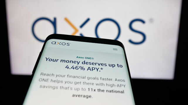 Stuttgart, Germany - 10-04-2025: Mobile phone with website of US banking company Axos Financial Inc. on screen in front of logo. Focus on top-left of phone display.