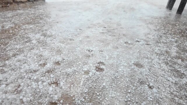 Severe hailstorm with fresh precipitation covering the environment, great for climate change themes