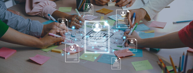 Fototapeta premium Concept of global talent acquisition and hiring. Human resources department reviewing candidate curriculum vitae and resumes for a job search and workforce selection process. Fermion