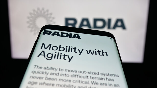 Stuttgart, Germany - 10-04-2025: Mobile phone with website of US aerospace company Radia Inc. on screen in front of logo. Focus on top-left of phone display.