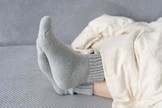 Sleeping in warm socks in cold winter