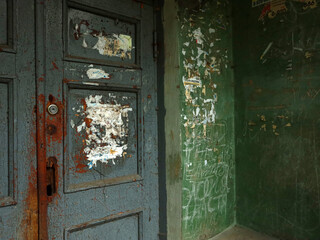 old green door with peeling paint
