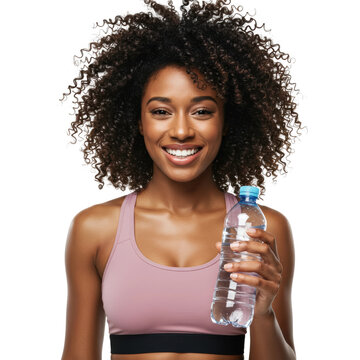 Smiling woman holding water bottle after workout
